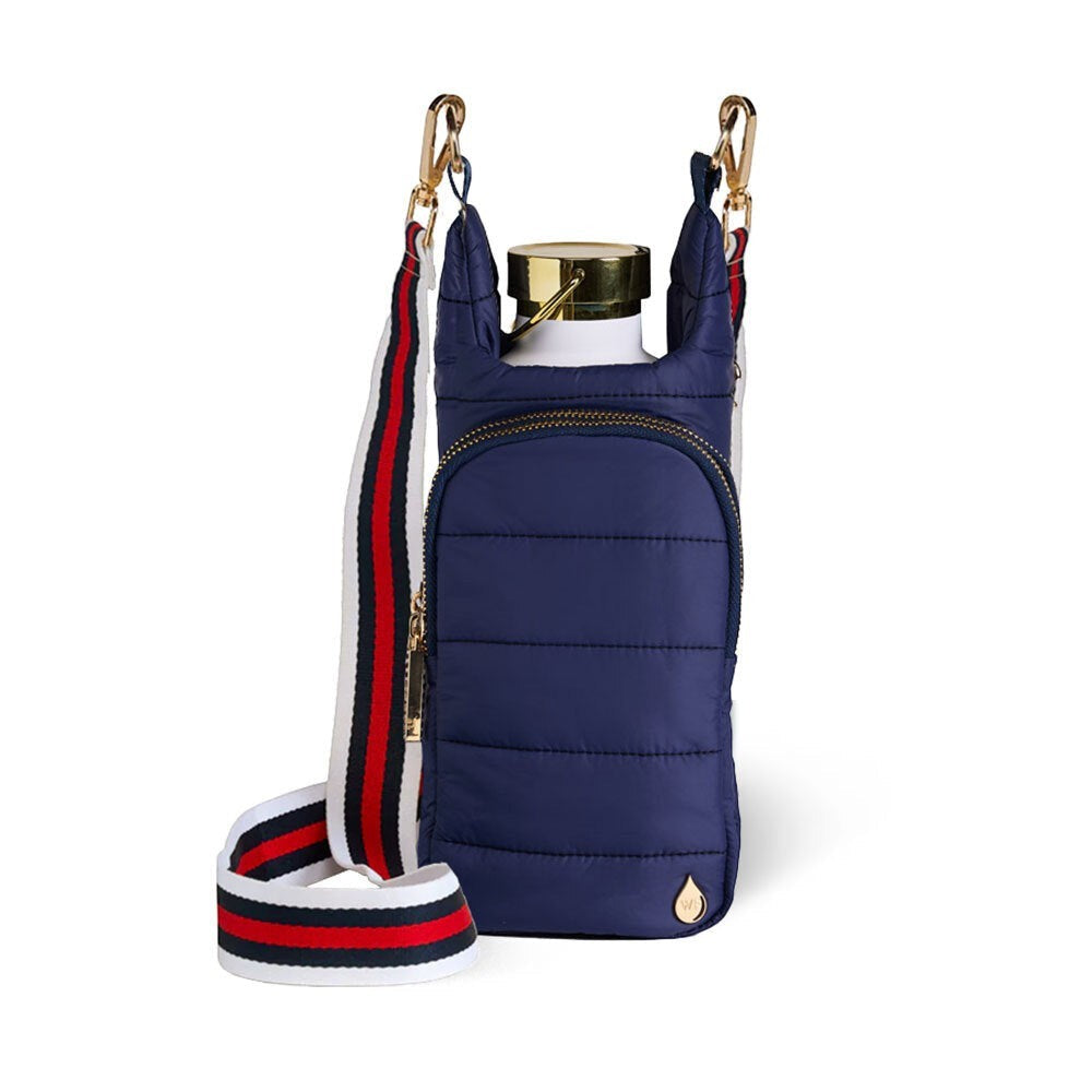 Sea Dragon Dreams navy quilted HydroBag water bottle crossbody carrier with a striped guitar strap and gold hardware.