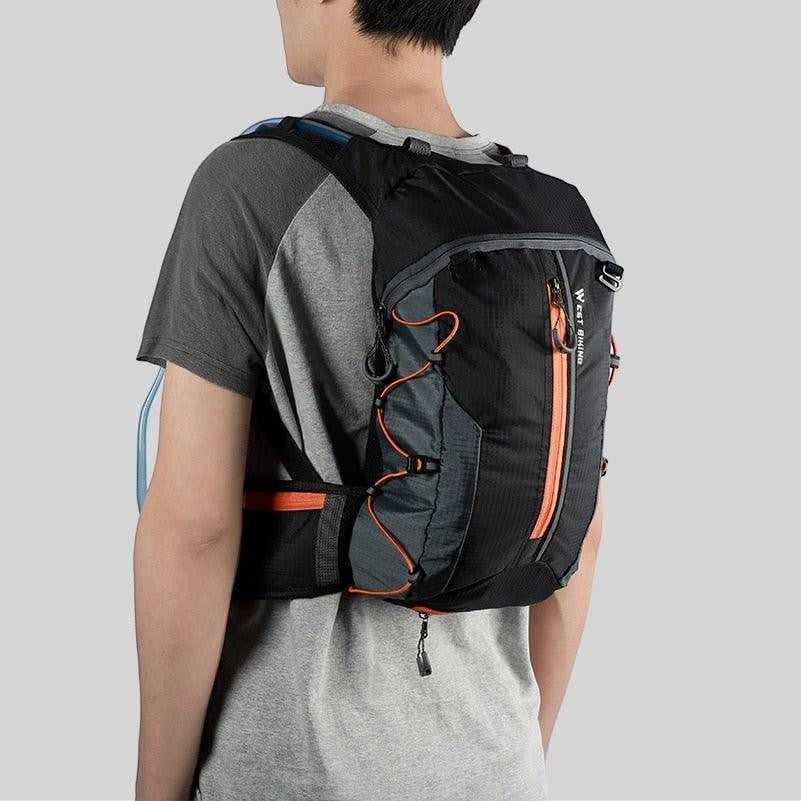 Sea Dragon Dreams 10L hydration backpack in black and grey ripstop fabric worn by a person for cycling and hiking.