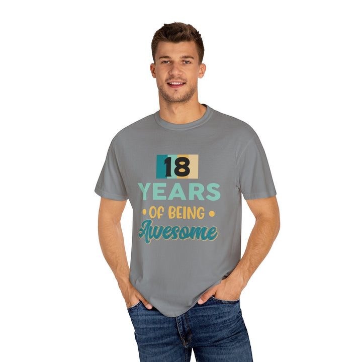 Sea Dragon Dreams unisex 18th birthday t-shirt in grey cotton with retro-style graphic print on a smiling man