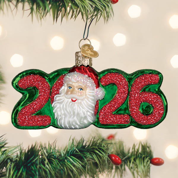 Sea Dragon Dreams 2026 Santa Christmas ornament with glittery red numbers and a festive Santa face on a pine tree