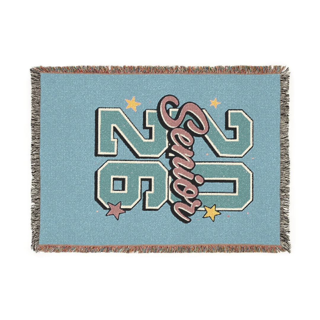 Sea Dragon Dreams 2026 Senior woven cotton throw blanket in light blue with decorative fringed edges.
