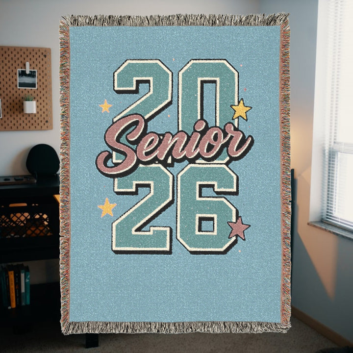 Sea Dragon Dreams 2026 Senior woven cotton throw blanket with blue background, fringed edges, and star accents.