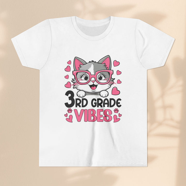 Sea Dragon Dreams white youth t-shirt featuring a cute cat wearing pink glasses and 3rd Grade Vibes text with hearts.