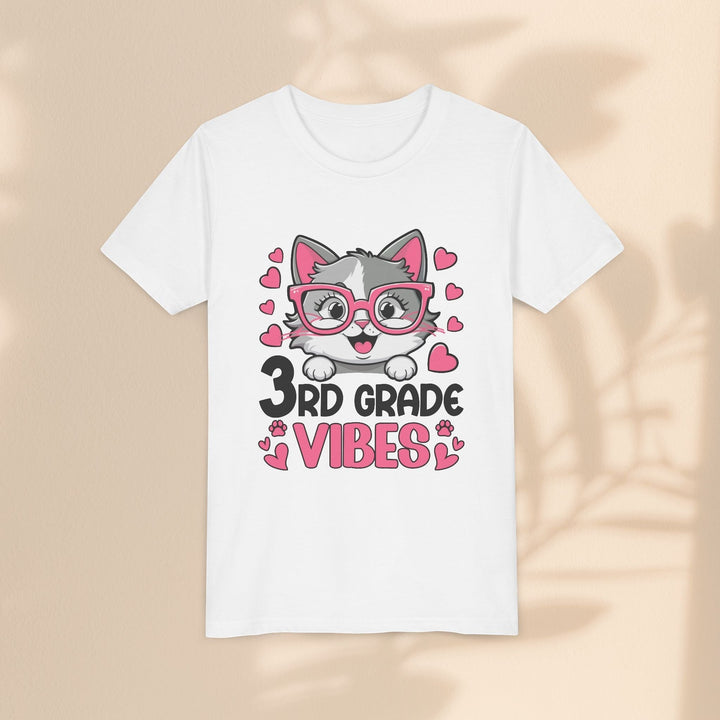 Sea Dragon Dreams white youth t-shirt with a cute cat wearing pink glasses and 3rd Grade Vibes text graphic.
