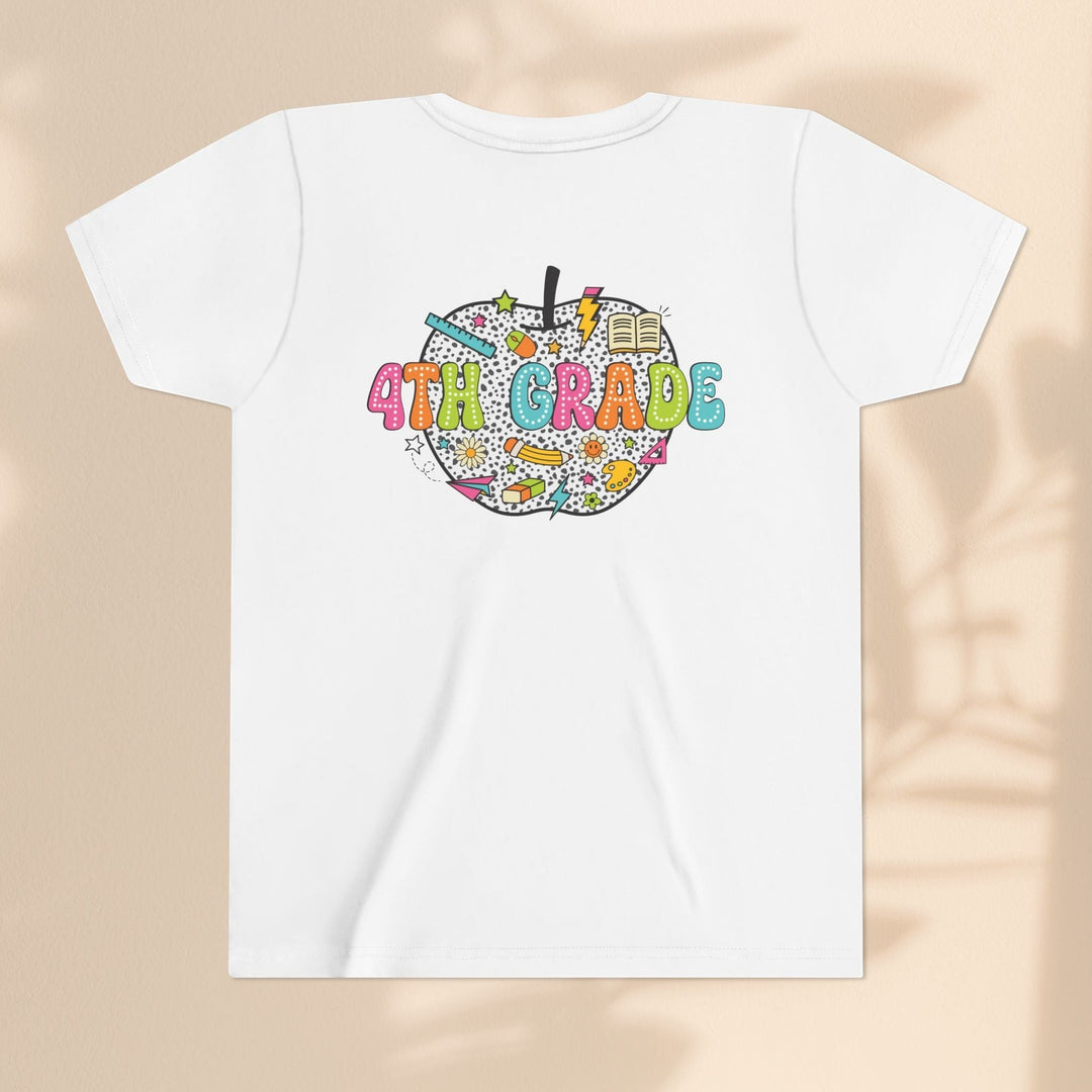 Sea Dragon Dreams white cotton youth t-shirt with a colorful 4th grade apple graphic featuring school supplies.