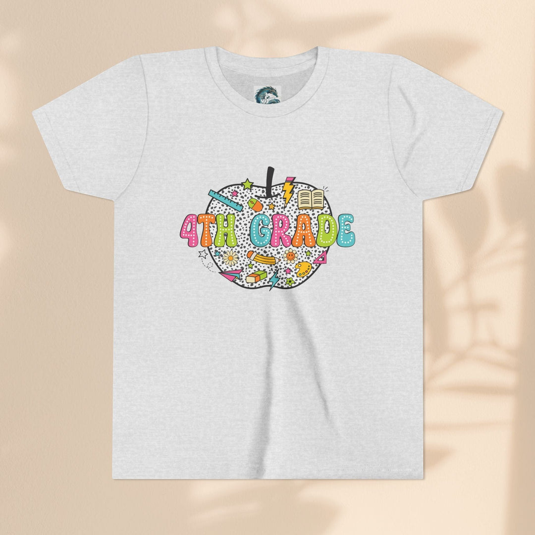Sea Dragon Dreams 4th grade youth t-shirt in light grey with a colorful apple graphic featuring school supplies.