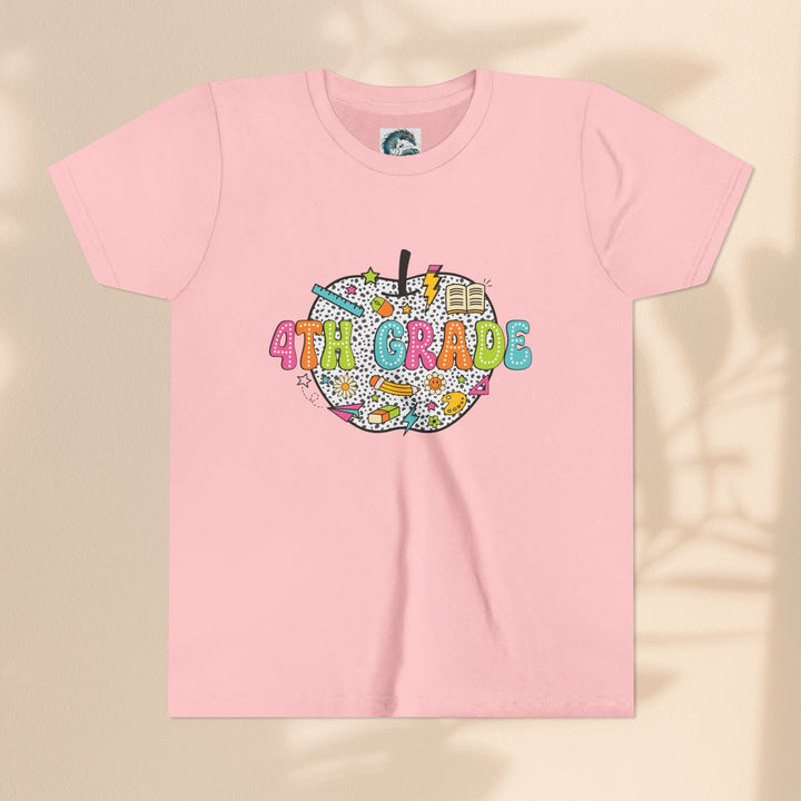 Sea Dragon Dreams light pink youth t-shirt with a 4th grade apple graphic featuring school supplies and patterns.