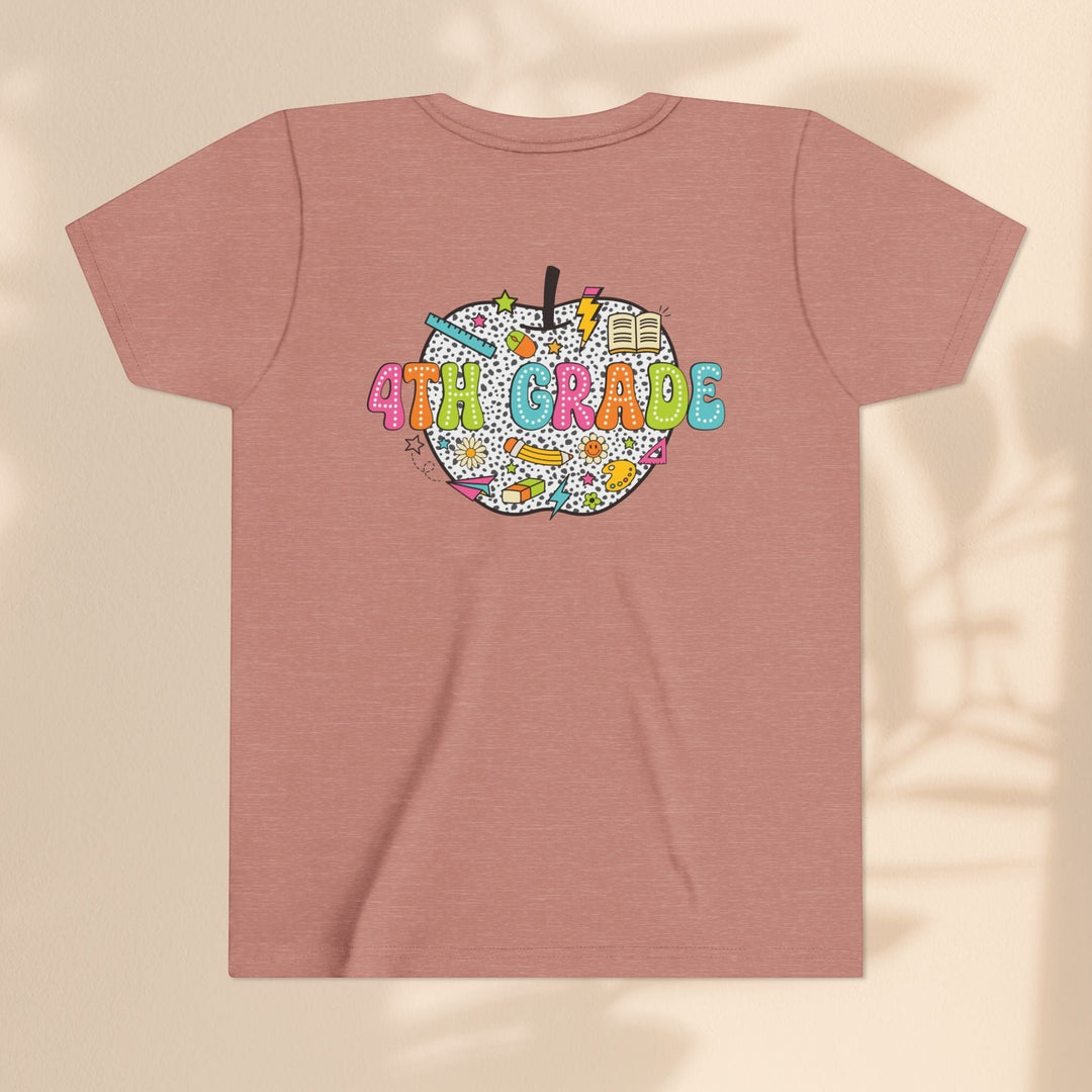 Sea Dragon Dreams 4th Grade youth t-shirt in dusty rose cotton with a colorful apple school supplies graphic on back