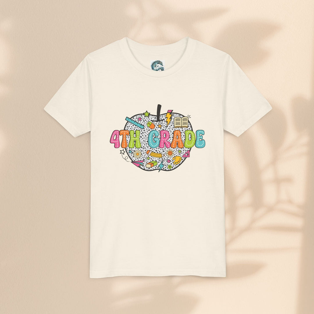 Sea Dragon Dreams 4th grade youth t-shirt in cream cotton with a colorful apple graphic and school supply motifs.