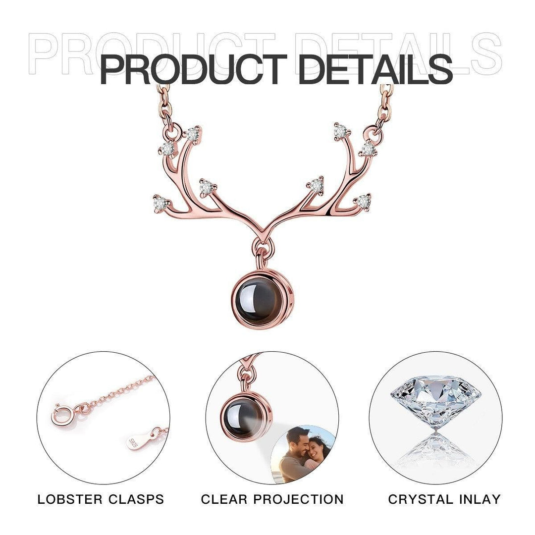 Sea Dragon Dreams rose gold antler necklace with crystal accents and a custom photo projection pendant.