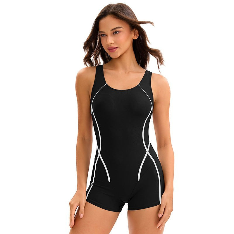 Sea Dragon Dreams athletic one-piece swimsuit in black with white piping, sleeveless design, and boxer-style shorts.