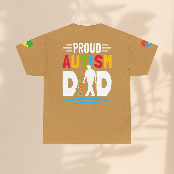 Sea Dragon Dreams Proud Autism Dad heavy cotton t-shirt in tan with a colorful graphic print on the back.