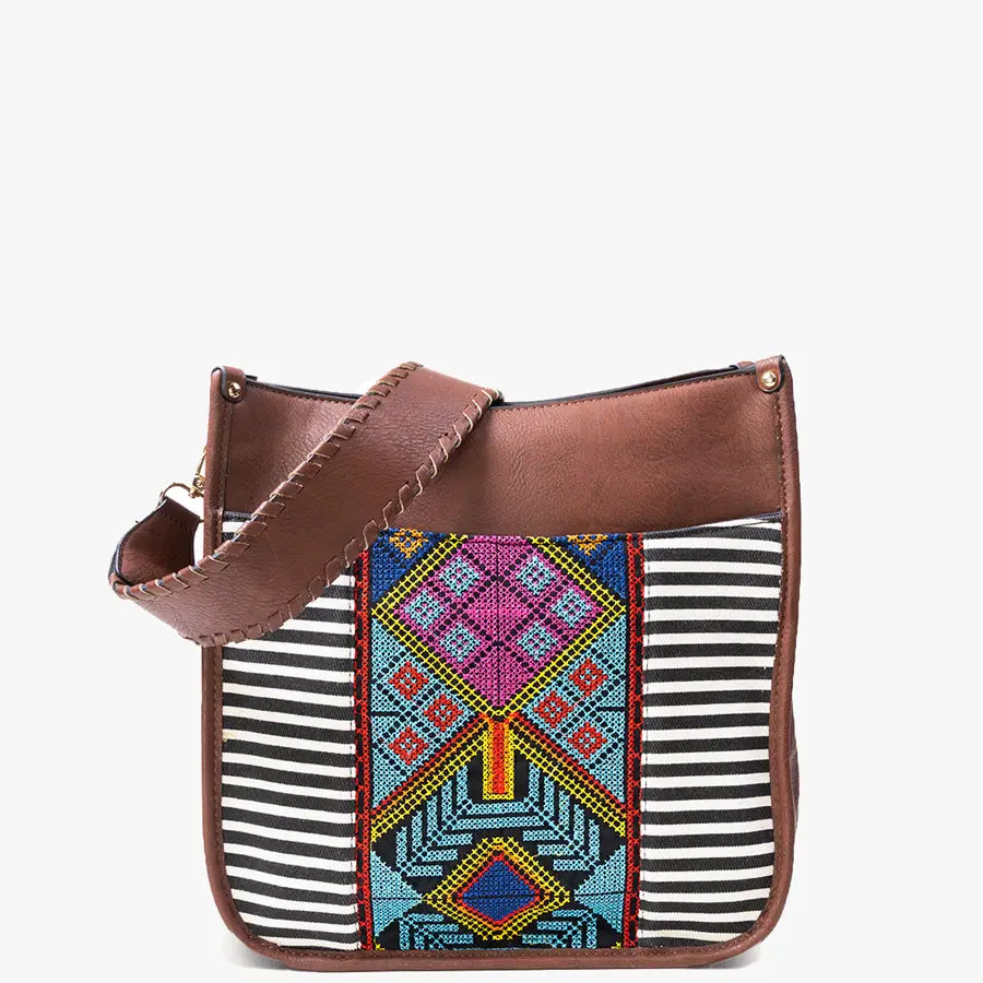 Sea Dragon Dreams satchel purse with brown faux leather, black and white stripes, and vibrant Aztec embroidery.