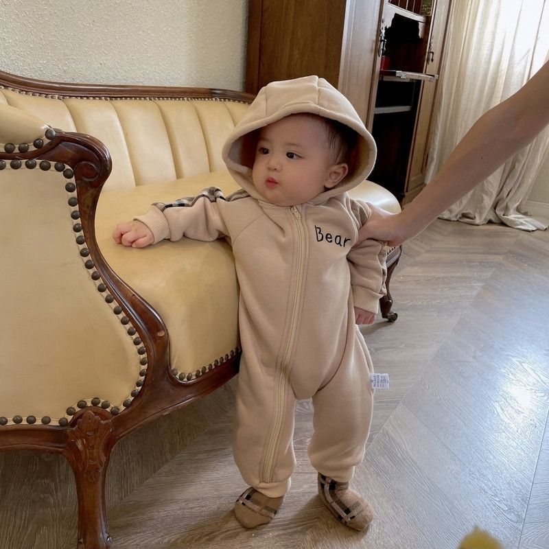 Sea Dragon Dreams baby onesie in beige with a hood, front zipper, and teddy bear detail for cozy winter wear.