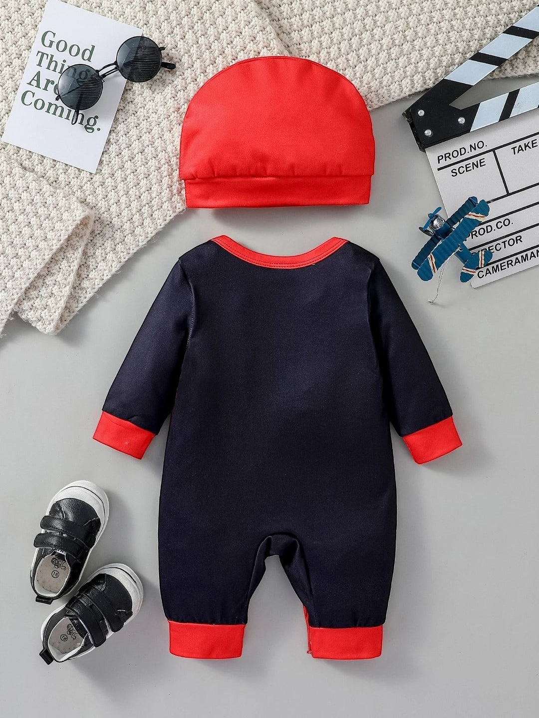 Sea Dragon Dreams baby boy 2-piece jumpsuit set in navy and red with a matching beanie hat for newborns.