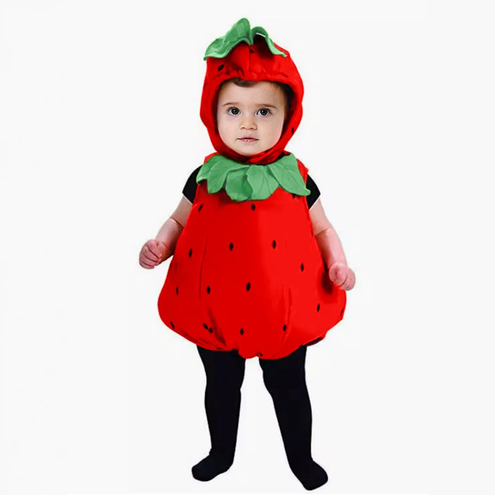 Sea Dragon Dreams baby wearing a red strawberry-shaped romper and matching leaf-topped hat for fall and winter