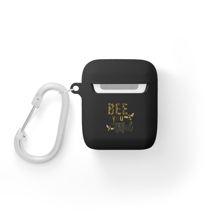 Sea Dragon Dreams black TPU AirPods case with Bee-You-Tiful floral bee design and white carabiner clip.