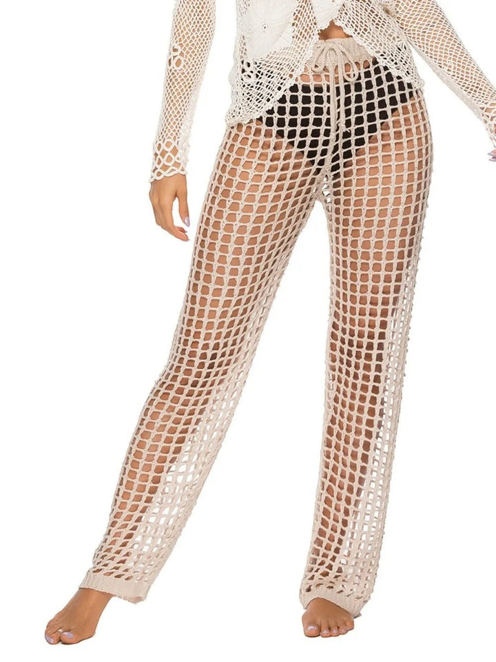 Sea Dragon Dreams high waist crochet swim pants in beige with cutout net design worn over black bikini bottoms