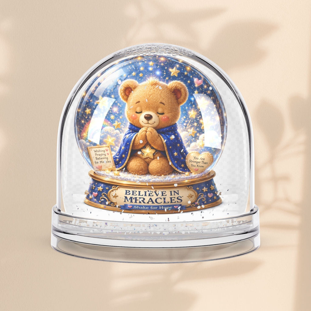 Sea Dragon Dreams Benny Brave Bear snow globe with Believe in Miracles message and glittery starry night scene.