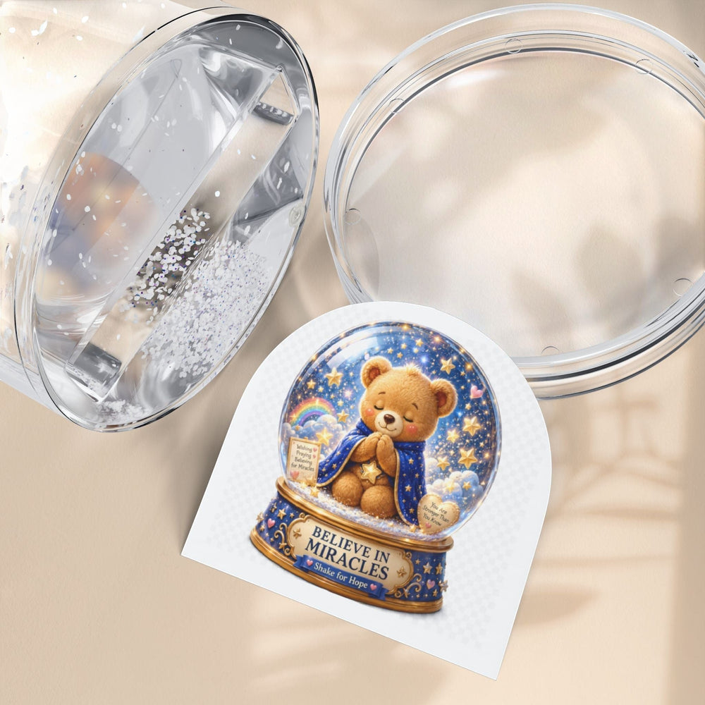 Sea Dragon Dreams Benny Brave Bear snow globe with Believe in Miracles message and glittery star-filled scene