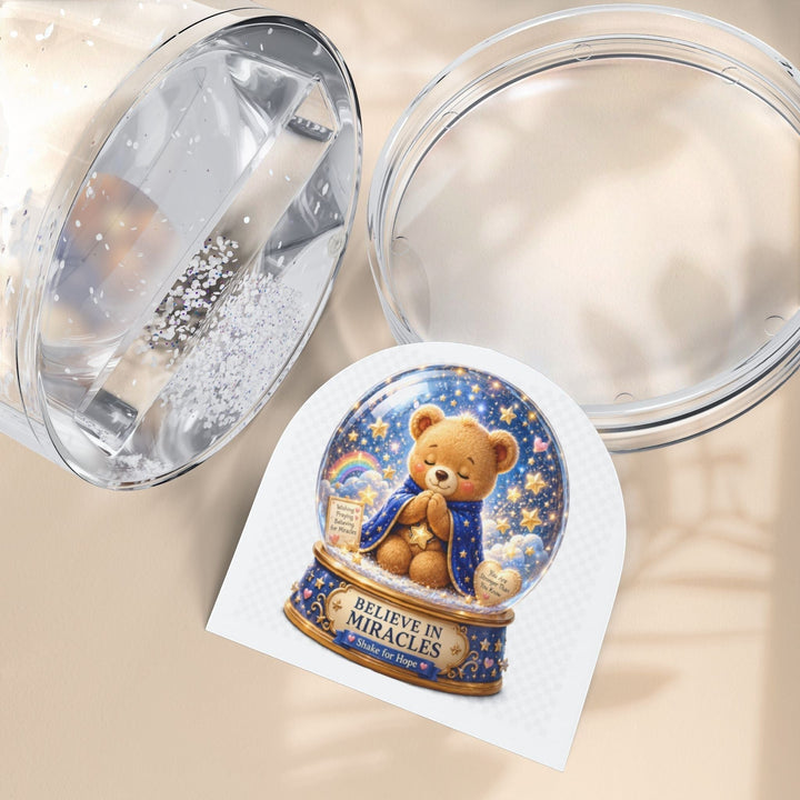 Sea Dragon Dreams Benny Brave Bear snow globe with Believe in Miracles message and glittery star-filled scene