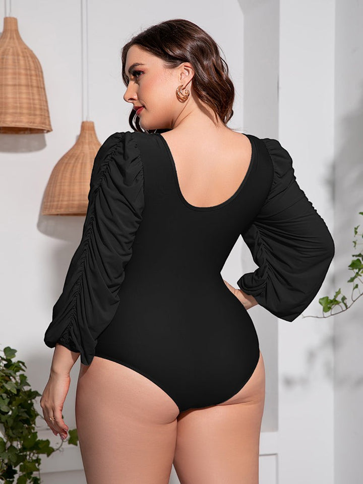 Sea Dragon Dreams plus size black one-piece swimsuit with ruched balloon sleeves and a scoop back