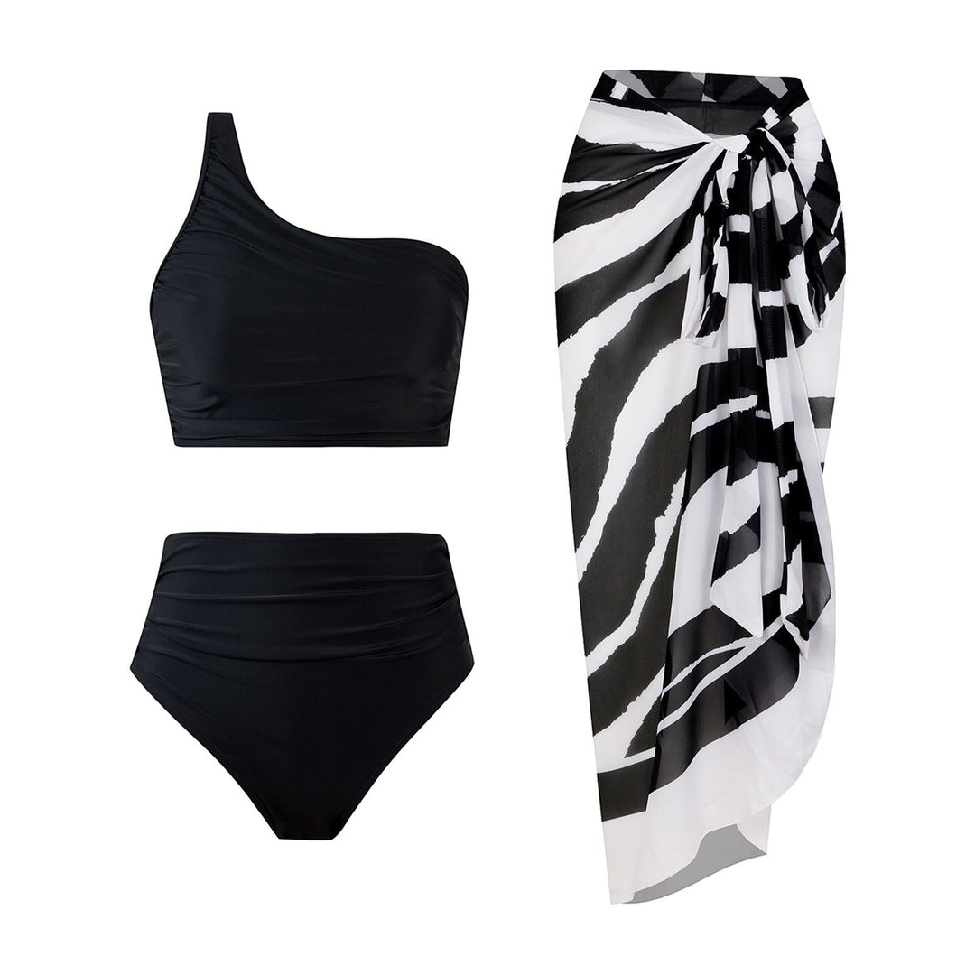 Sea Dragon Dreams black one-shoulder bikini set with high-waisted bottoms and a zebra print sarong wrap