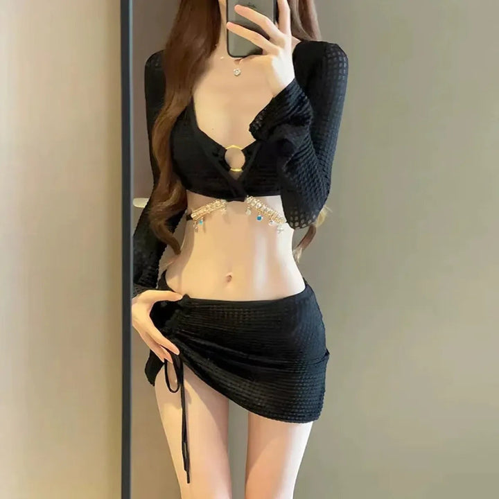 Sea Dragon Dreams black 4-piece bikini set with diamond chain trim, long sleeves, and adjustable drawstring mini skirt.