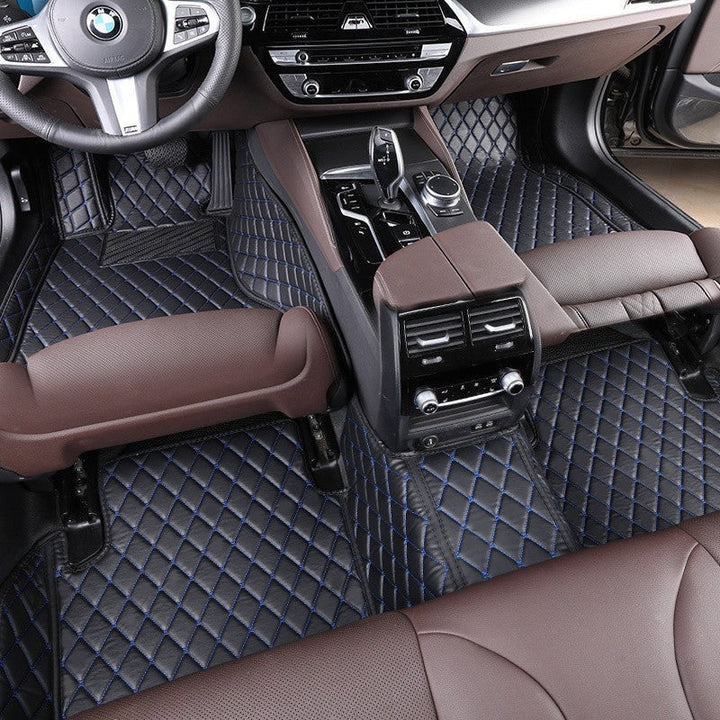 Sea Dragon Dreams black TPE car floor mats with blue stitching installed in a 5-seat vehicle interior