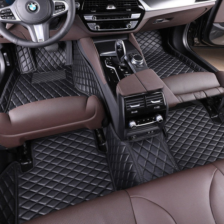 Sea Dragon Dreams black car floor mats with diamond stitching installed in a luxury vehicle interior