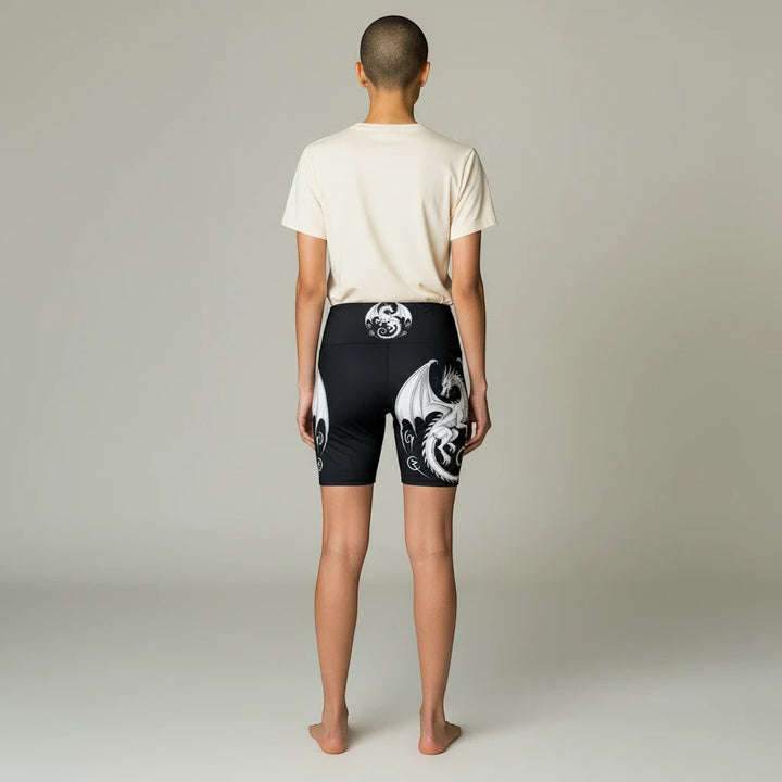 Sea Dragon Dreams women's black athletic shorts with white dragon print, featuring a gusset for flexible movement.