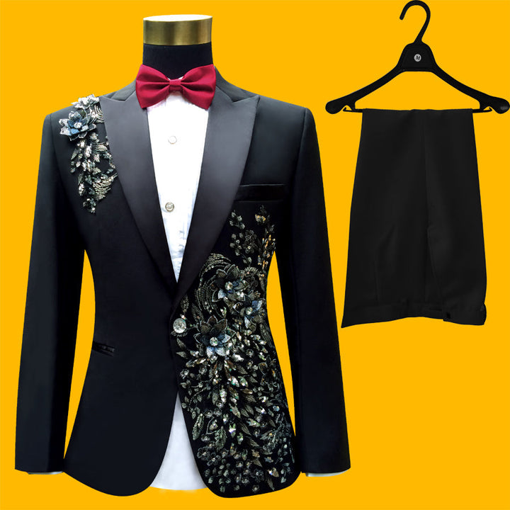 Sea Dragon Dreams black slim-fit tuxedo suit with blue floral paillette embroidery, including blazer and trousers.