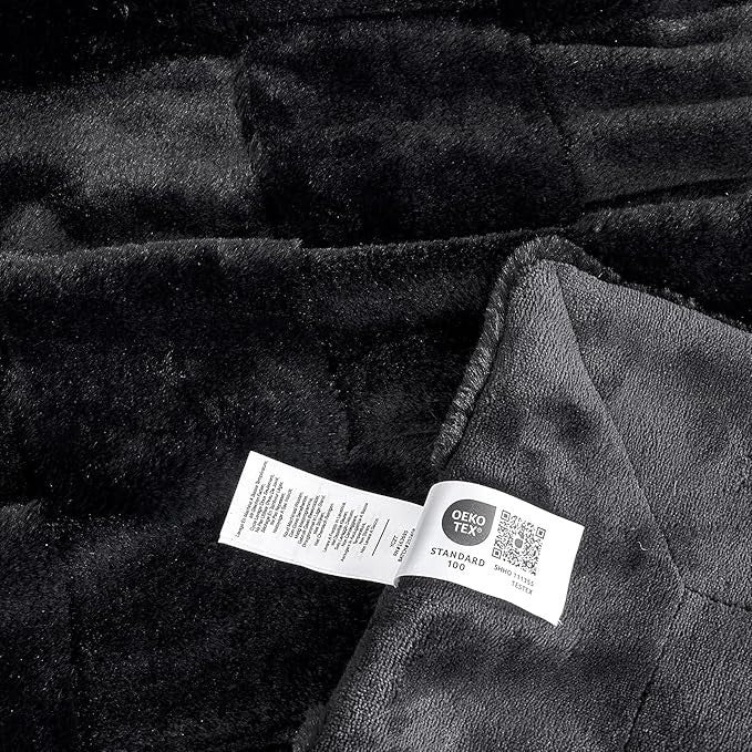 Sea Dragon Dreams black faux rabbit fur queen blanket with checkered texture and OEKO-TEX certified care label.