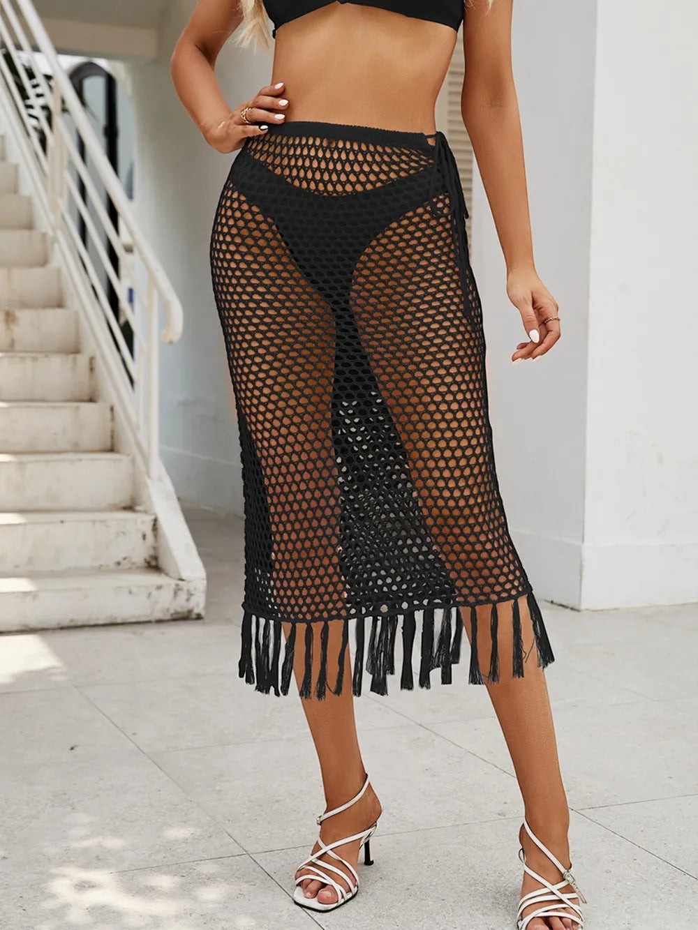 Sea Dragon Dreams black high waist swim skirt with openwork crochet fabric and fringe hem detail