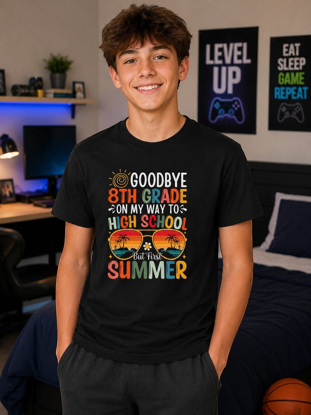 Sea Dragon Dreams black cotton kids t-shirt with Goodbye 8th Grade summer graphic worn by a smiling boy in a bedroom.