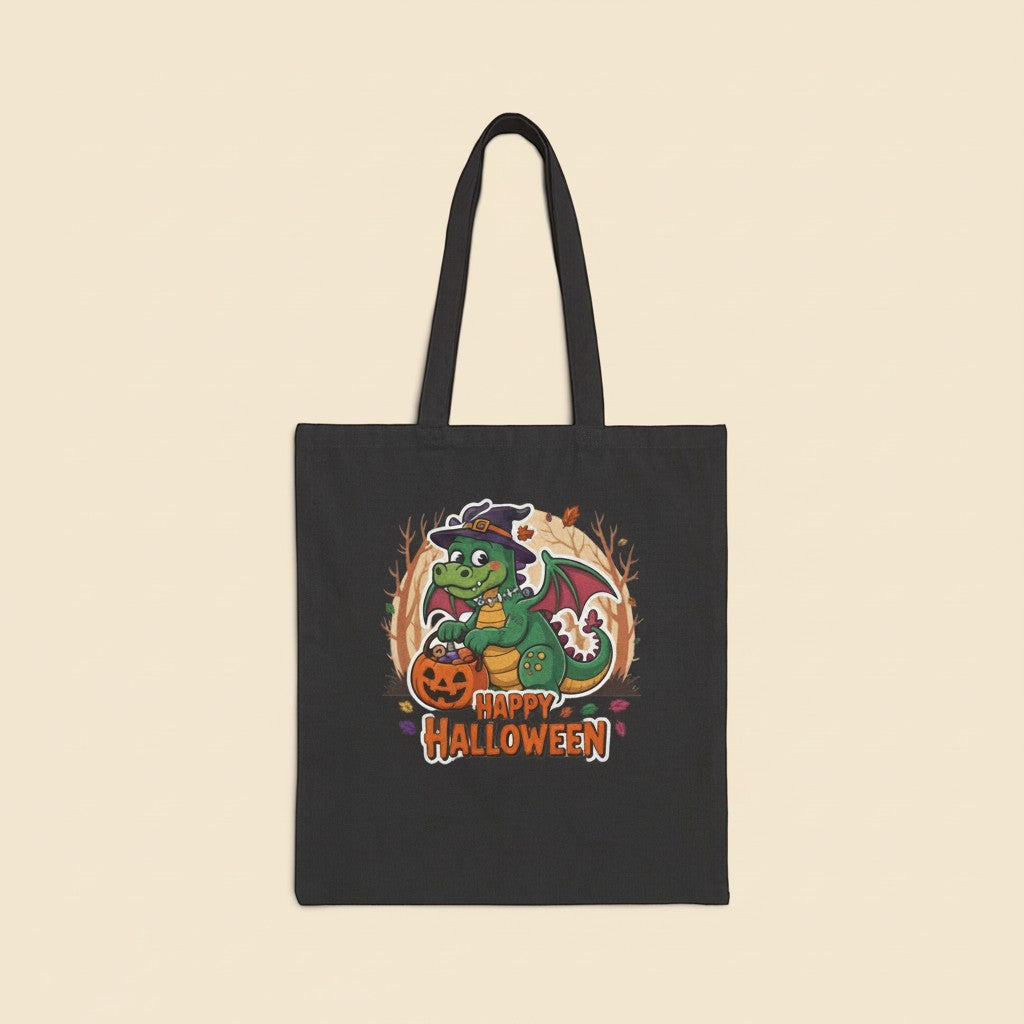 Sea Dragon Dreams black cotton canvas tote bag featuring a cute green dragon in a witch hat with a pumpkin
