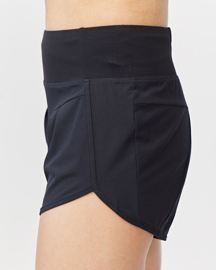 Sea Dragon Dreams black high rise running shorts with a wide knit waistband and side zip pocket, side view