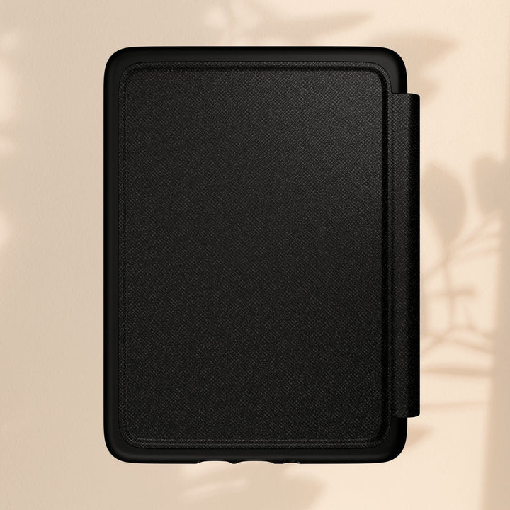 Sea Dragon Dreams black Kindle case with a textured PU leather finish and magnetic closure on a neutral background.