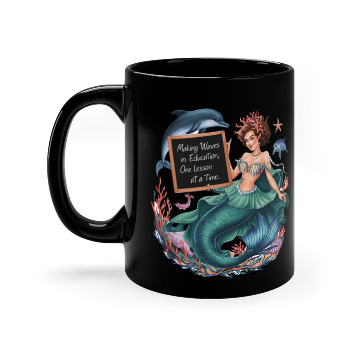Sea Dragon Dreams black ceramic mug featuring a mermaid holding a chalkboard that says Making Waves in Education