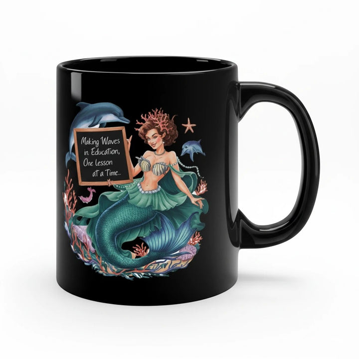 Sea Dragon Dreams black 11oz ceramic coffee mug featuring a mermaid holding a chalkboard sign about education.