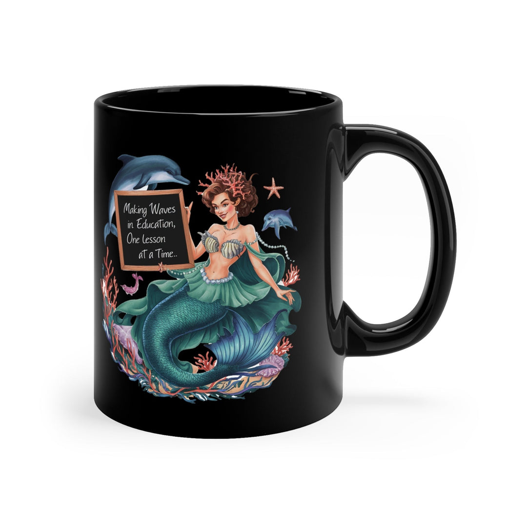 Sea Dragon Dreams black ceramic 11oz mug featuring a mermaid holding a chalkboard with Waves in Education text
