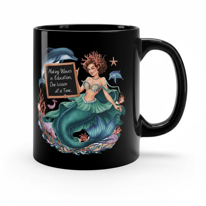 Sea Dragon Dreams black ceramic 11oz coffee mug featuring a mermaid teacher illustration with dolphins and coral.