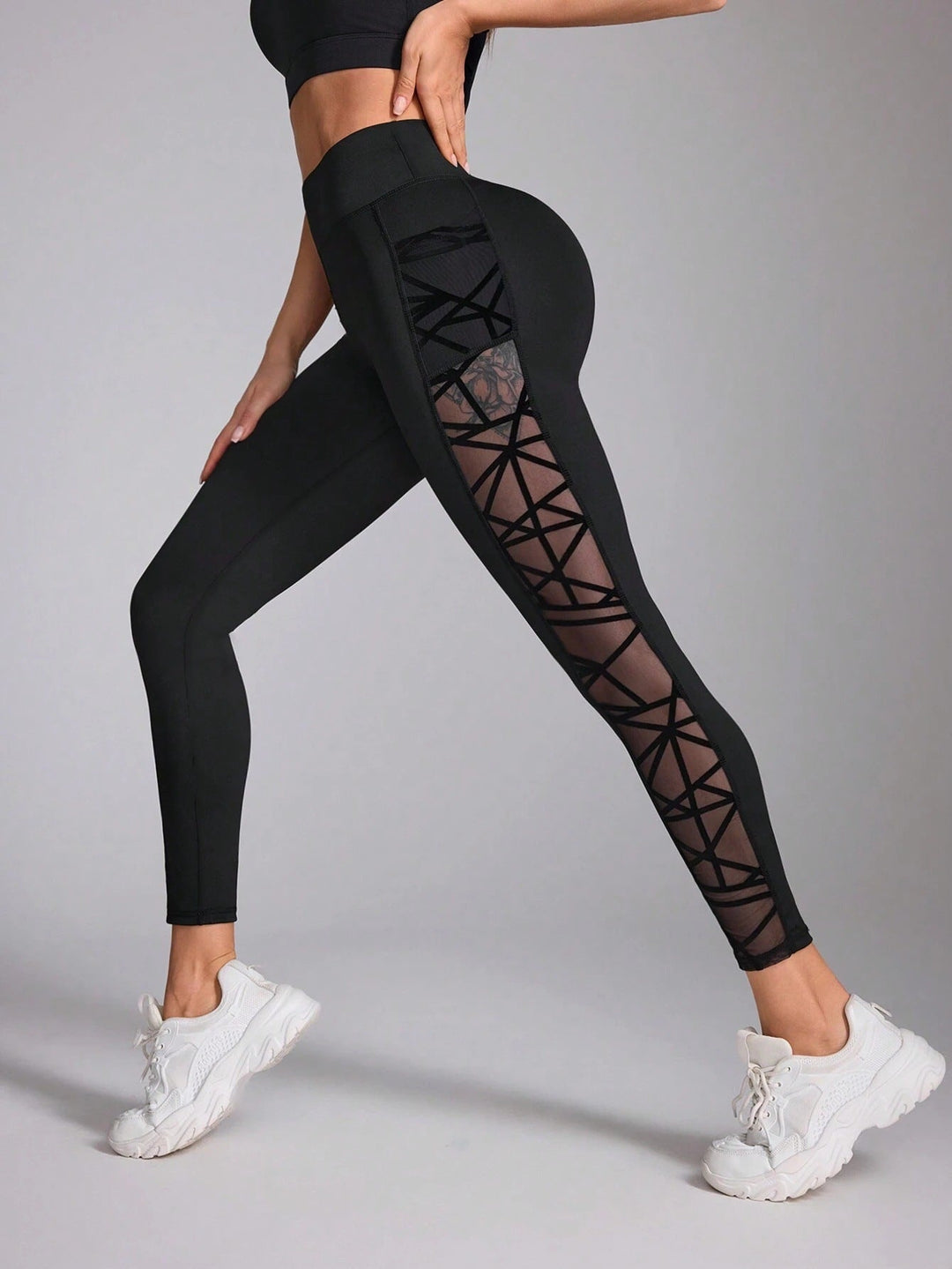 Sea Dragon Dreams black high-waist workout leggings with geometric mesh contrast side panels and athletic fit