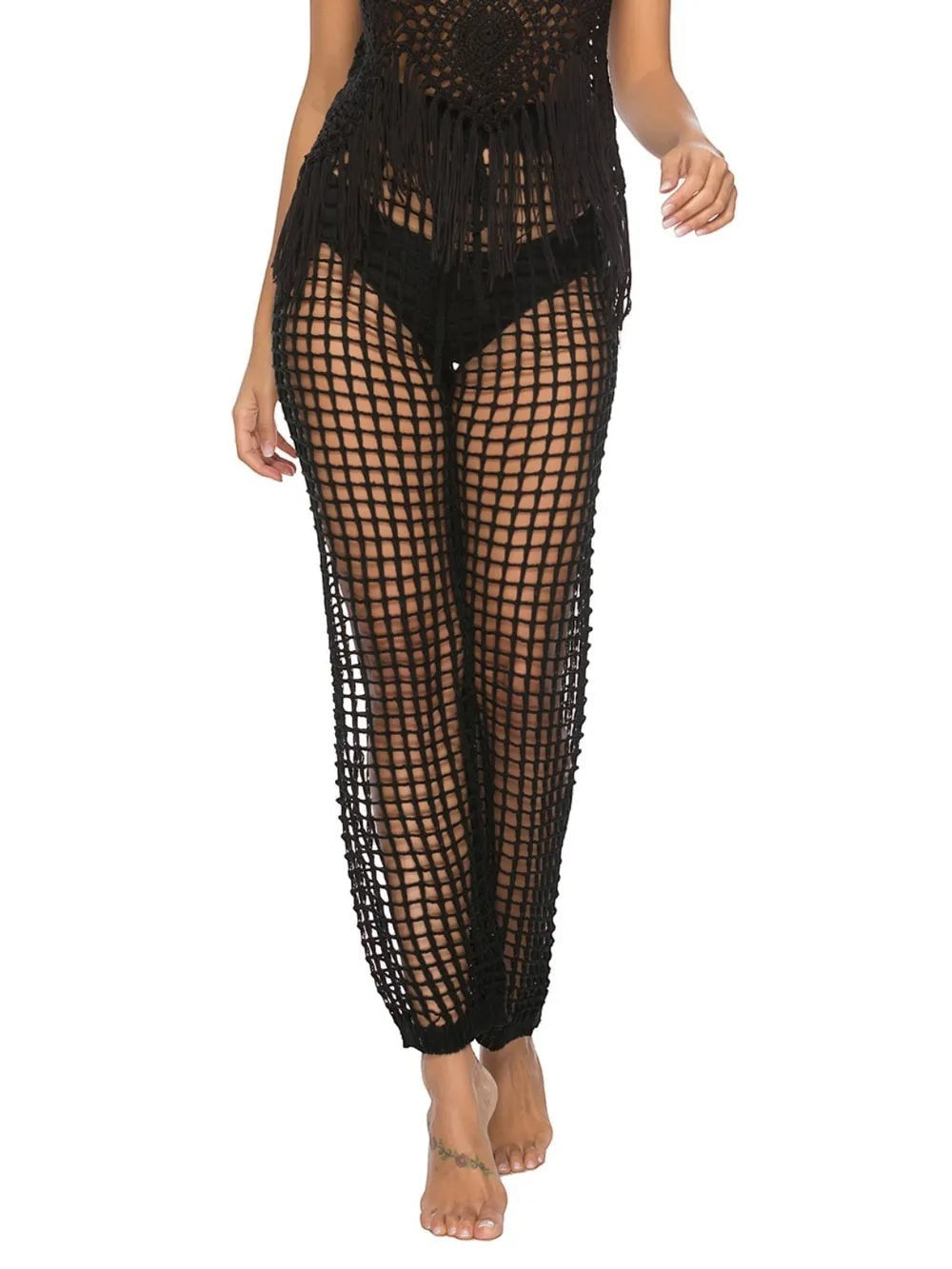 Sea Dragon Dreams black high waist cutout swim pants in a mesh net style worn by a model