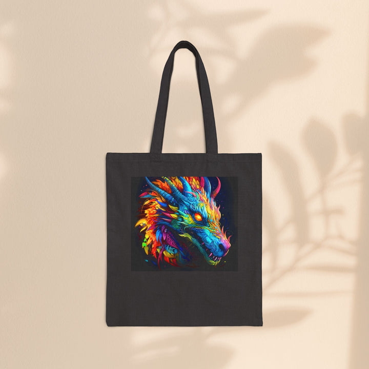 Sea Dragon Dreams black cotton canvas tote bag featuring a vibrant neon dragon illustration on a neutral wall background