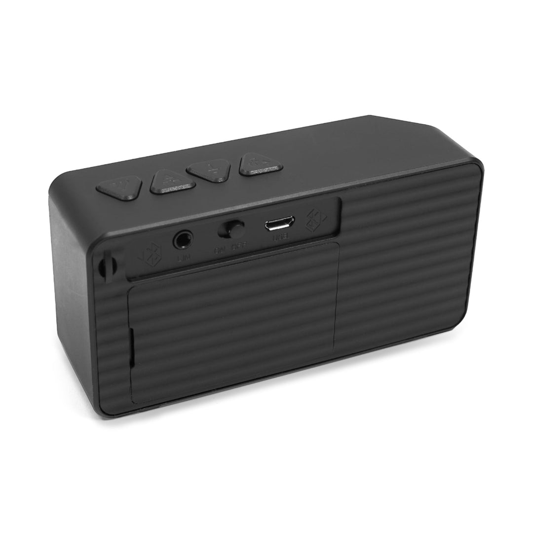 Sea Dragon Dreams portable Bluetooth speaker in matte black ABS plastic, showing rear ports and top control buttons.