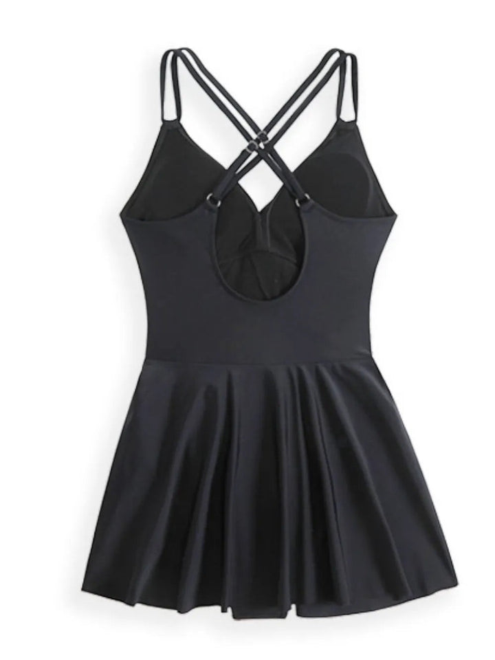 Sea Dragon Dreams black one-piece swimsuit with a flared skirt and crisscross double spaghetti straps on the back.