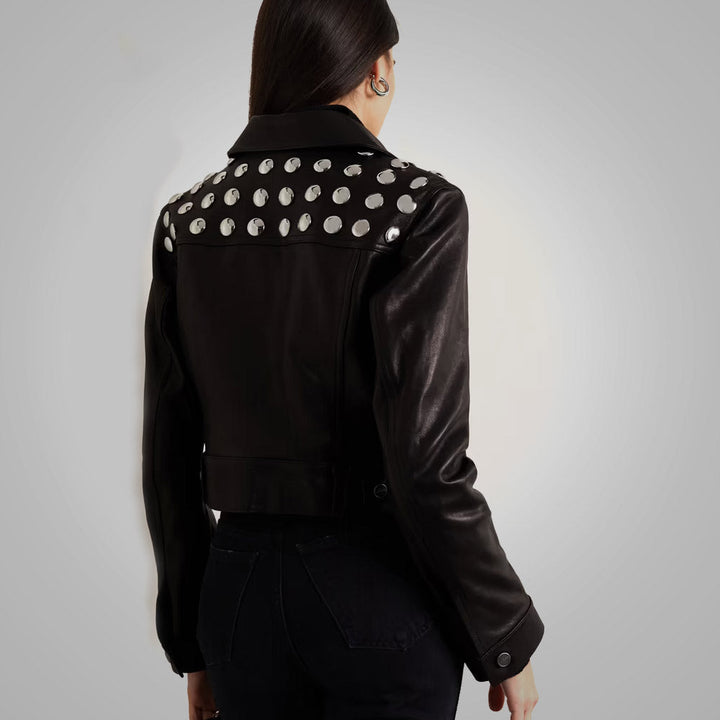 Sea Dragon Dreams black cropped leather jacket with silver studs on the back and shearling collar, worn by a model.
