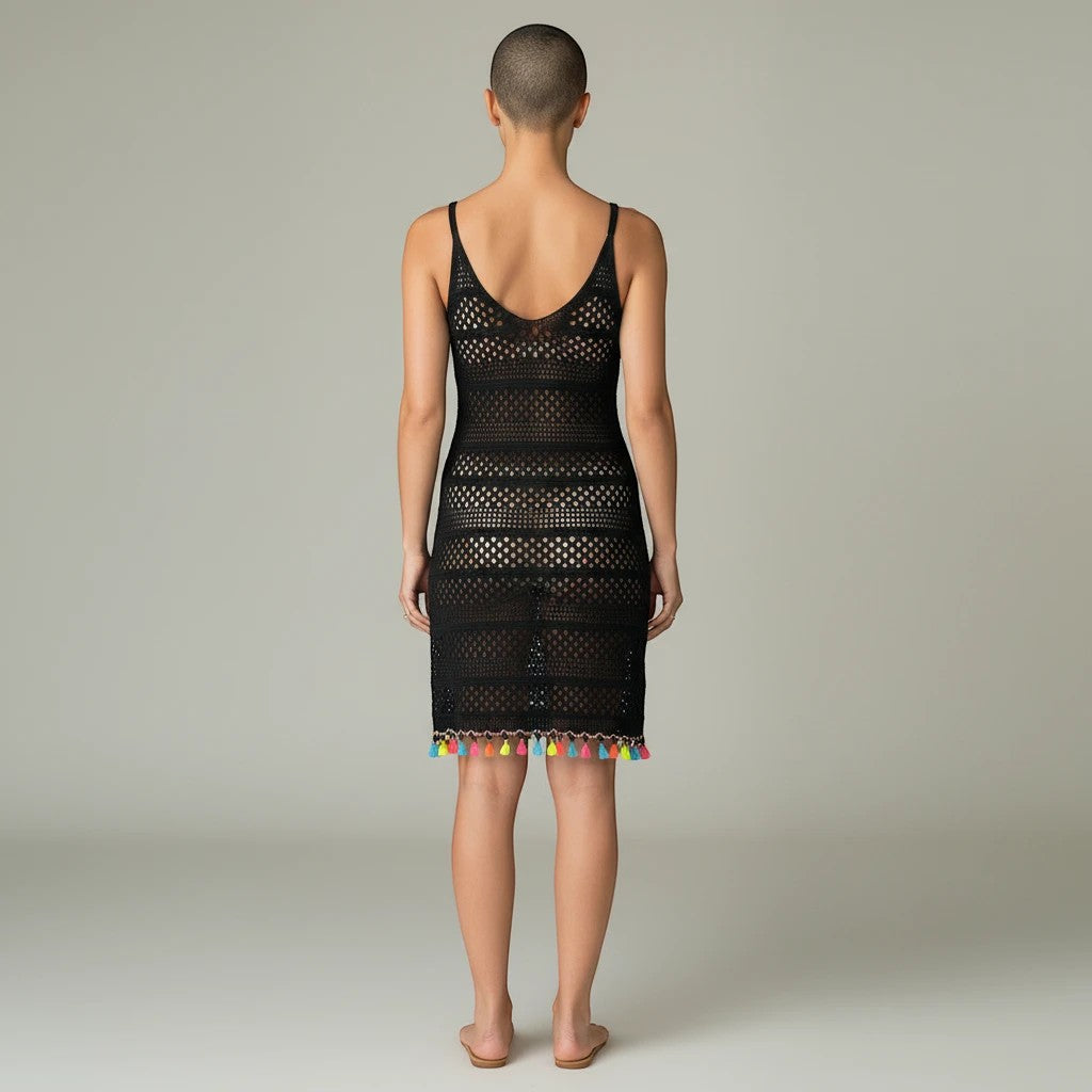 Sea Dragon Dreams black hollow-out woven beach cover-up dress with colorful tassel hem, back view on a model