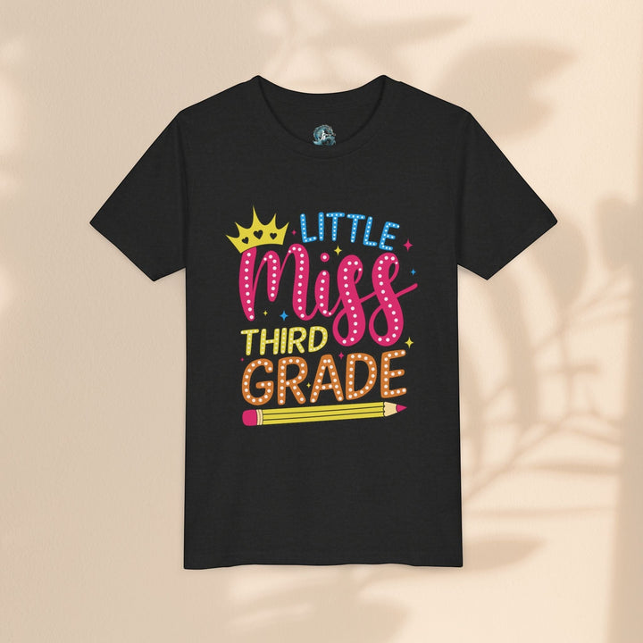 Sea Dragon Dreams black youth t-shirt with Little Miss Third Grade graphic featuring a crown and pencil design.